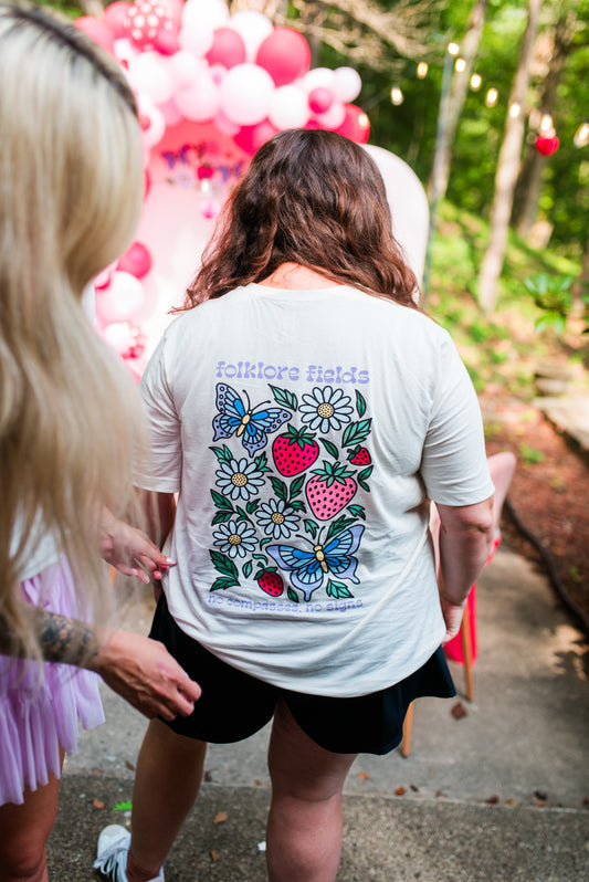 Folklore Fields T-Shirt – Soft Cotton Tee with Strawberry, Butterfly & Compass Design